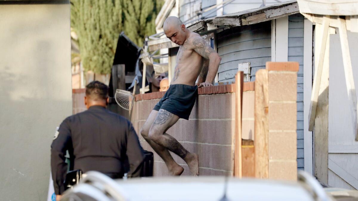 A man being chased by police is taken into custody in the 1900 block of Keeler Street in Burbank.
