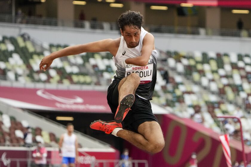 Afghanistan's Hossain Rasouli competes in the men's T47 long jump during the 2020 Paralympics.