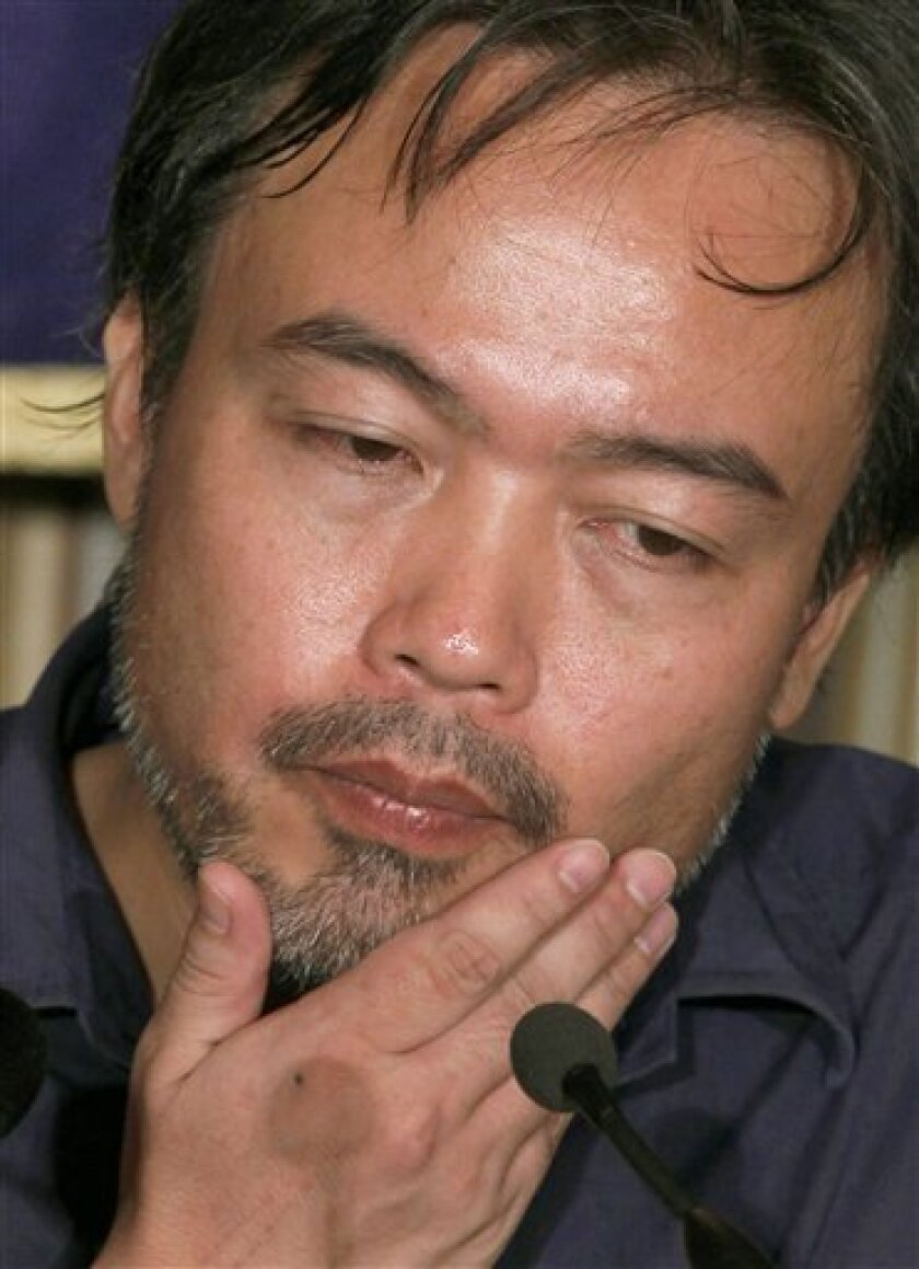 Freed Japanese freelance journalist Kosuke Tsuneoka ponders on reporters' questions during a press conference at the Foreign Correspondents' Club of Japan in Tokyo, Tuesday, Sept. 7, 2010. Tsuneoka was kidnapped in April, when he traveled to a Taliban-controlled area in northern Afghanistan, and was released Saturday night to a Japanese Embassy. (AP Photo/Shizuo Kambayashi)