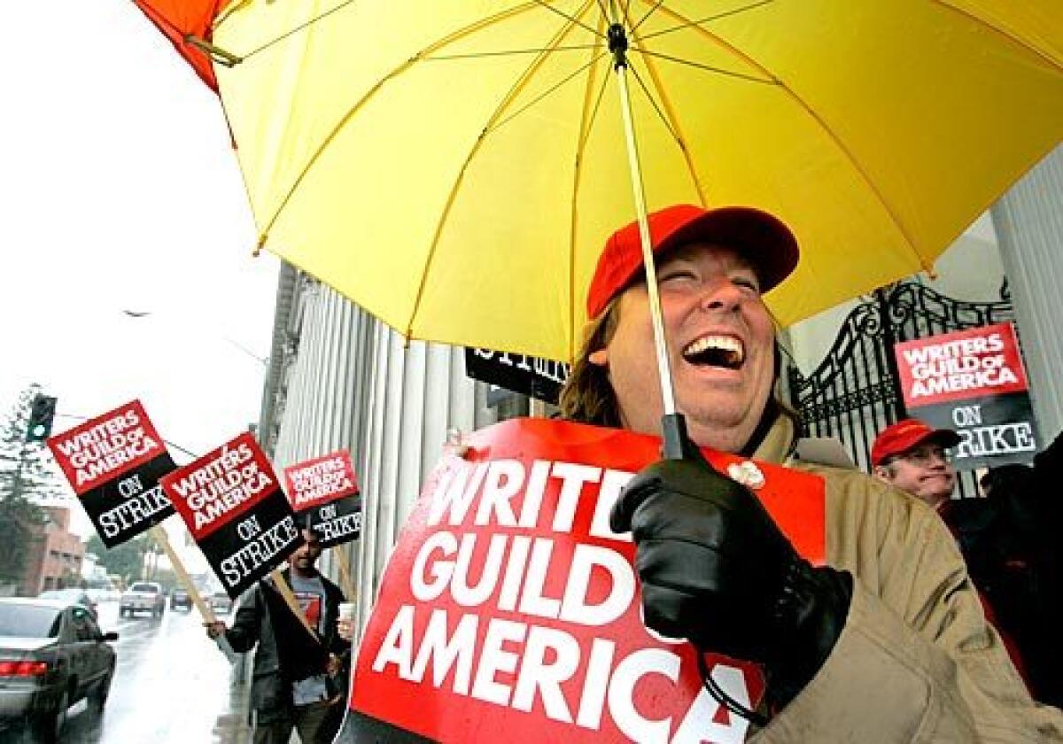 The rain dampened picket lines, if not spirits, as John Matta and compatriots from the Writers Guild of America walked outside Sony Pictures in Culver City on Friday morning.