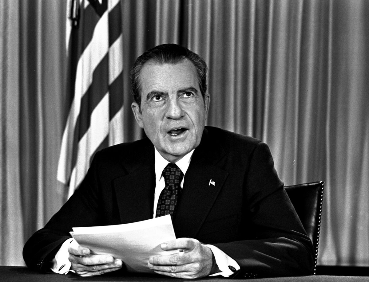 FILE - President Nixon sits in his White House office on Aug. 16, 1973, as he poses for photographer after delivering a nationwide television address dealing with Watergate. Nixon repeated that he had no prior knowledge of the Watergate break-in and was not aware of any cover-up. (AP Photo, File)