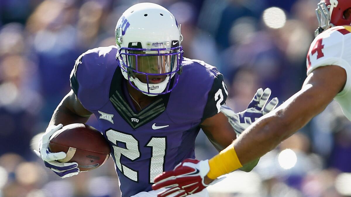 Texas Christian running back Kyle Hicks carries the ball during a blowout win over Iowa State on Dec. 6.