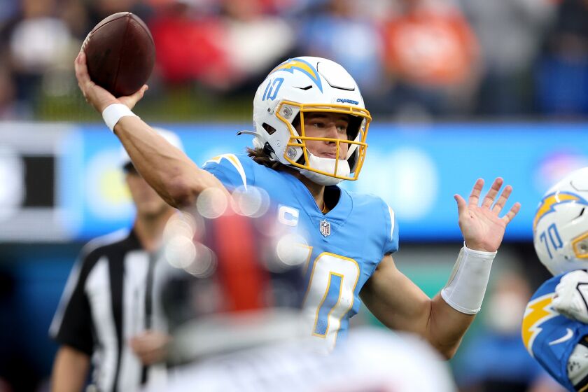 INGLEWOOD, CALIFORNIA - JANUARY 02: Justin Herbert #10 of the Los Angeles Chargers delivers a pass over the Denver Broncos in the second quarter of the game at SoFi Stadium on January 02, 2022 in Inglewood, California. (Photo by Sean M. Haffey/Getty Images)