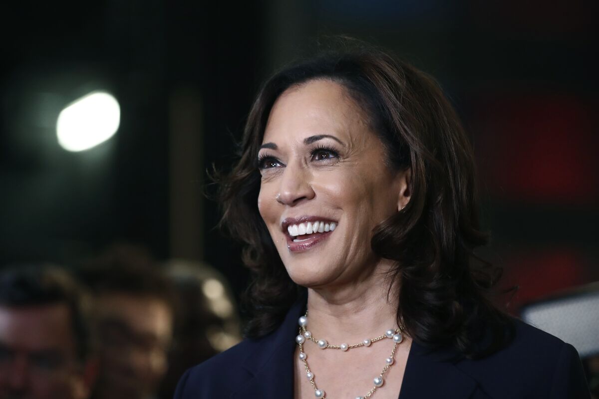 FILE - In this June 27, 2019, file photo, then-Democratic presidential candidate Sen. Kamala Harris, D-Calif., listens to questions after the Democratic primary debate hosted by NBC News at the Adrienne Arsht Center for the Performing Art in Miami. (AP Photo/Brynn Anderson, File)