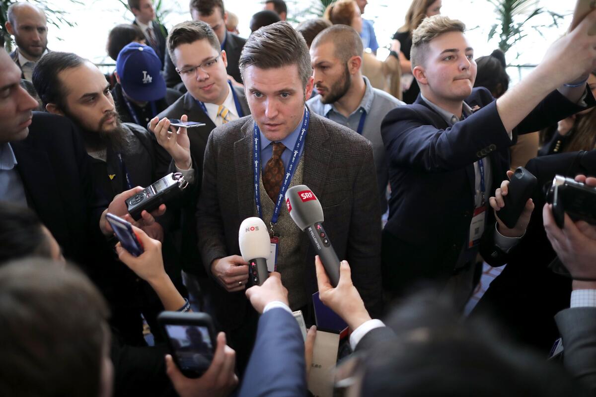 Reporters surround white supremacist Richard Spencer during the first day of the Conservative Political Action Conference on February 23, 2017.