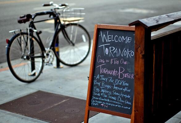 The chef's daily specials are written on a blackboard outside.