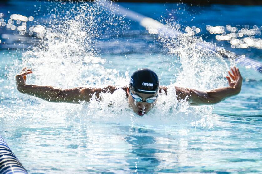 Logan Noguchi of Torrey Pines High School swims in the 100 yard butterfly event at the CIF-San Diego Division I championship held at Granite Hills High School May, 6, 2023 in El Cajon, Calif. (Photo by Denis Poroy)