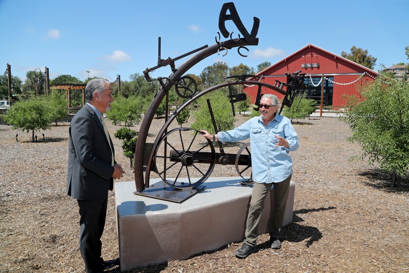 Artist Jon Seeman, right, speaks to Aliso Viejo Mayor Ross Chun at Aliso Viejo Ranch.