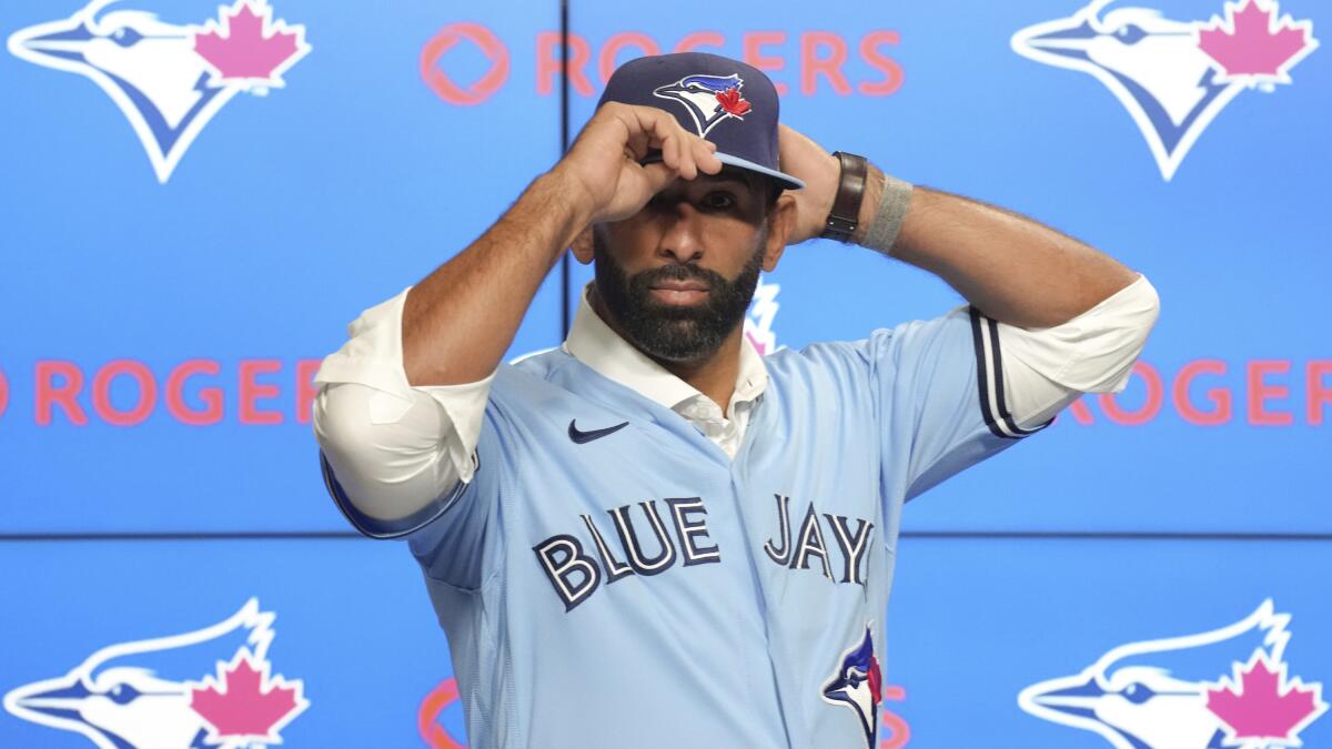 Former Toronto Blue Jays player Jose Bautista throws the