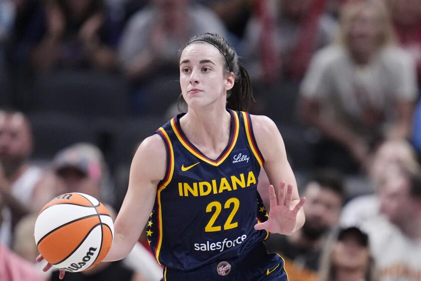 Indiana Fever guard Caitlin Clark (22) drives up court in the second half of a WNBA basketball game against the New York Liberty, Thursday, May 16, 2024, in Indianapolis. (AP Photo/Michael Conroy)