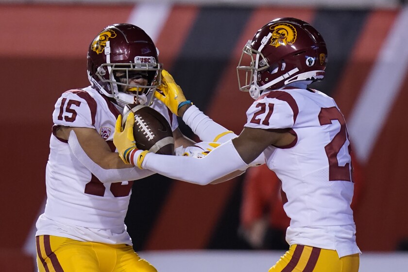 Southern California's Tyler Vaughns (21) celebrates his touchdown against Utah with Drake London (15) during the first half of an NCAA college football game Saturday, Nov. 21, 2020, in Salt Lake City. (AP Photo/Rick Bowmer)