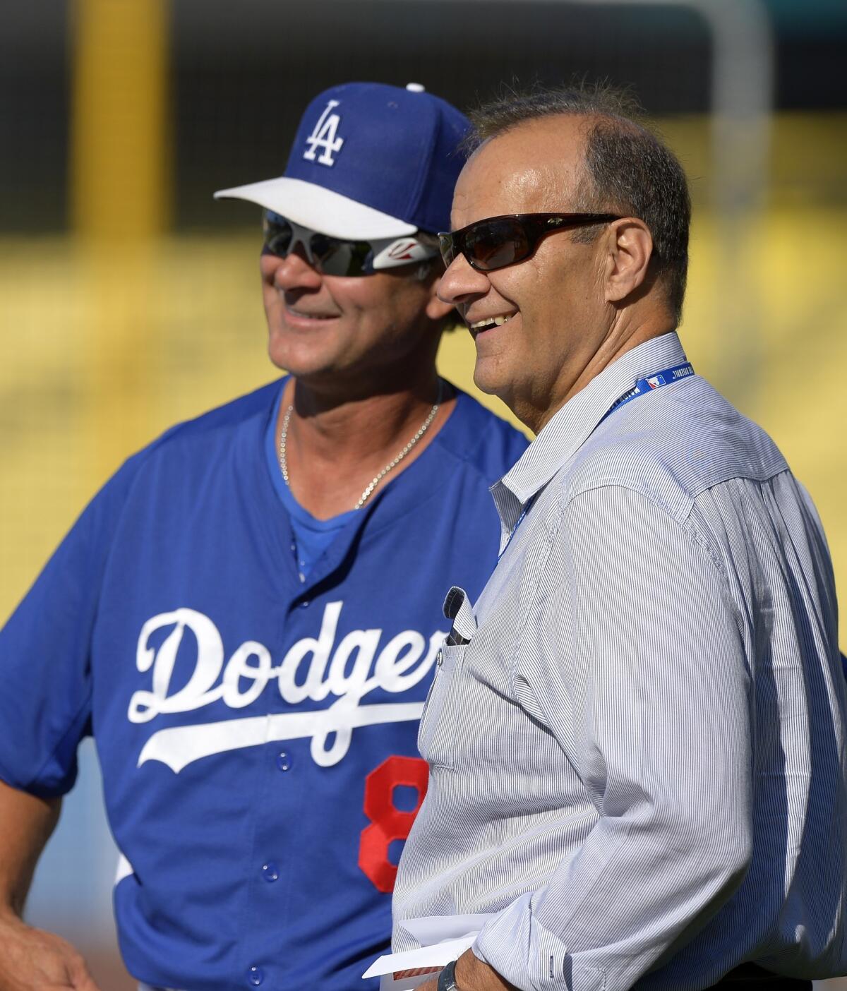 Former Dodgers manager Joe Torre, right, understands what Don Mattingly is experiencing in regard to his former protege's current contract situation.