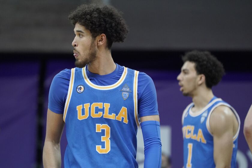 UCLA guard Johnny Juzang (3) reacts after a play against Washington during the second half of an NCAA college basketball game, Saturday, Feb. 13, 2021, in Seattle. (AP Photo/Ted S. Warren)