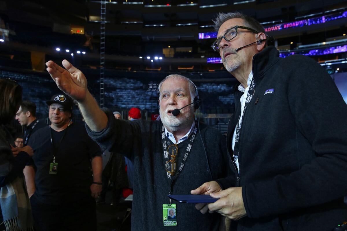 Ken Ehrlich, left, talks with stage manager Garry Hood during rehearsals at Madison Square Garden for the 60th Annual Grammy Awards celebrating the show's return to New York City on Jan. 25, 2018.