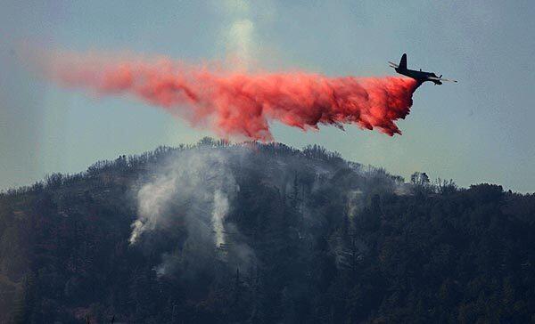 An air tanker drops flame retardant over the Sheep fire in the San Bernardino National Forest. By Monday evening, the 7,824-acre blaze was 30% contained. Full story
