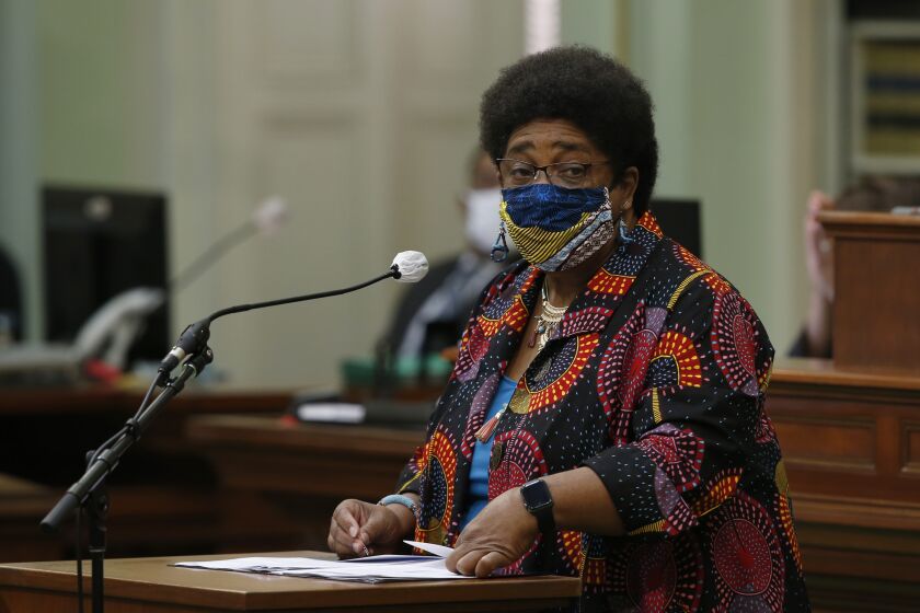 Assemblywoman Shirley Weber, D-San Diego, wears a face mask as she calls on lawmakers to create a task force to study and develop reparation proposals for African Americans, during the Assembly session in Sacramento, Calif., Thursday, June 11, 2020. The Assembly approved the bill that now goes to the Senate. (AP Photo/Rich Pedroncelli)