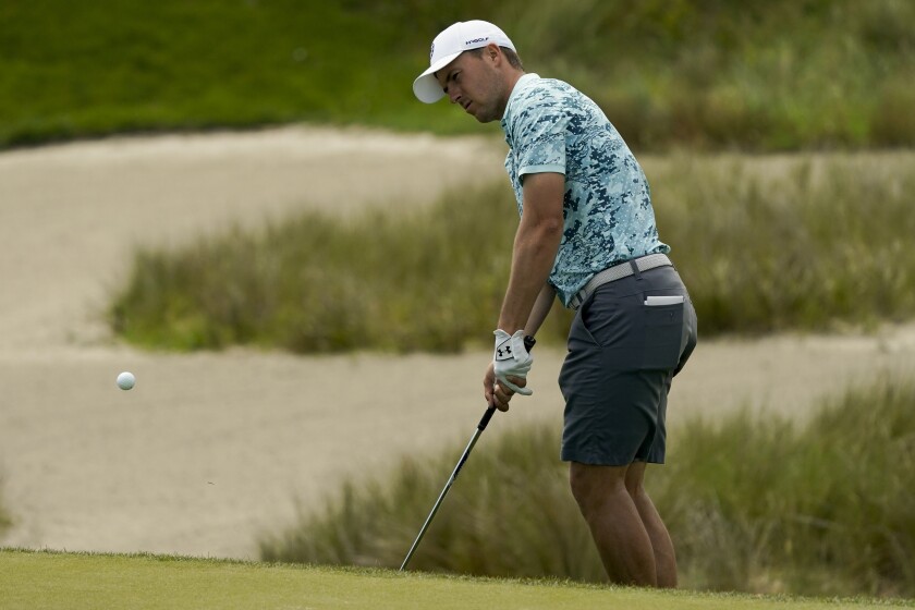 Jordan Spieth chips to the green on the 16th hole during a practice round at the PGA Championship golf tournament on the Ocean Course Tuesday, May 18, 2021, in Kiawah Island, S.C. (AP Photo/Matt York)