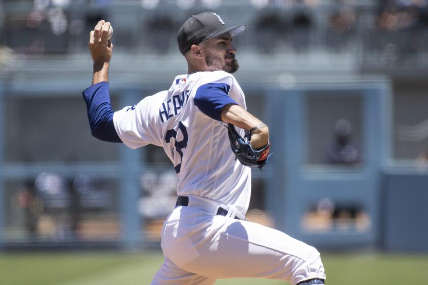 Los Angeles Dodgers starting pitcher Andrew Heaney throws during the first inning.