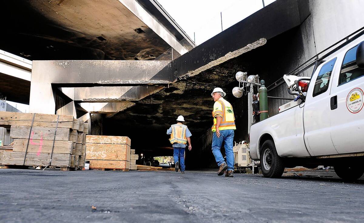 Road repair continues where a tanker truck toppled in a tunnel at the interchange of the 5 and 2 freeways, causing a traffic-disrupting inferno, and severe damage, near Stadium Way in Los Angeles.