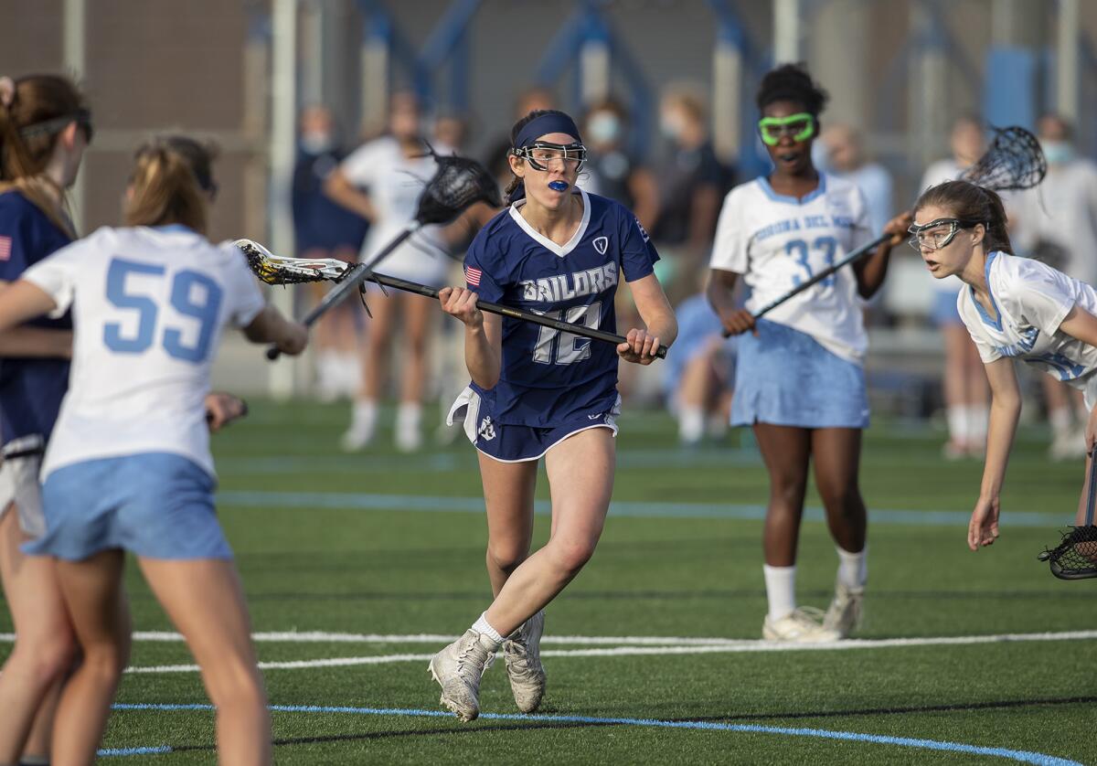 Newport Harbor's Olivia Gritzmacher looks for an open shot during Tuesday's Sunset League match against rival Corona del Mar.