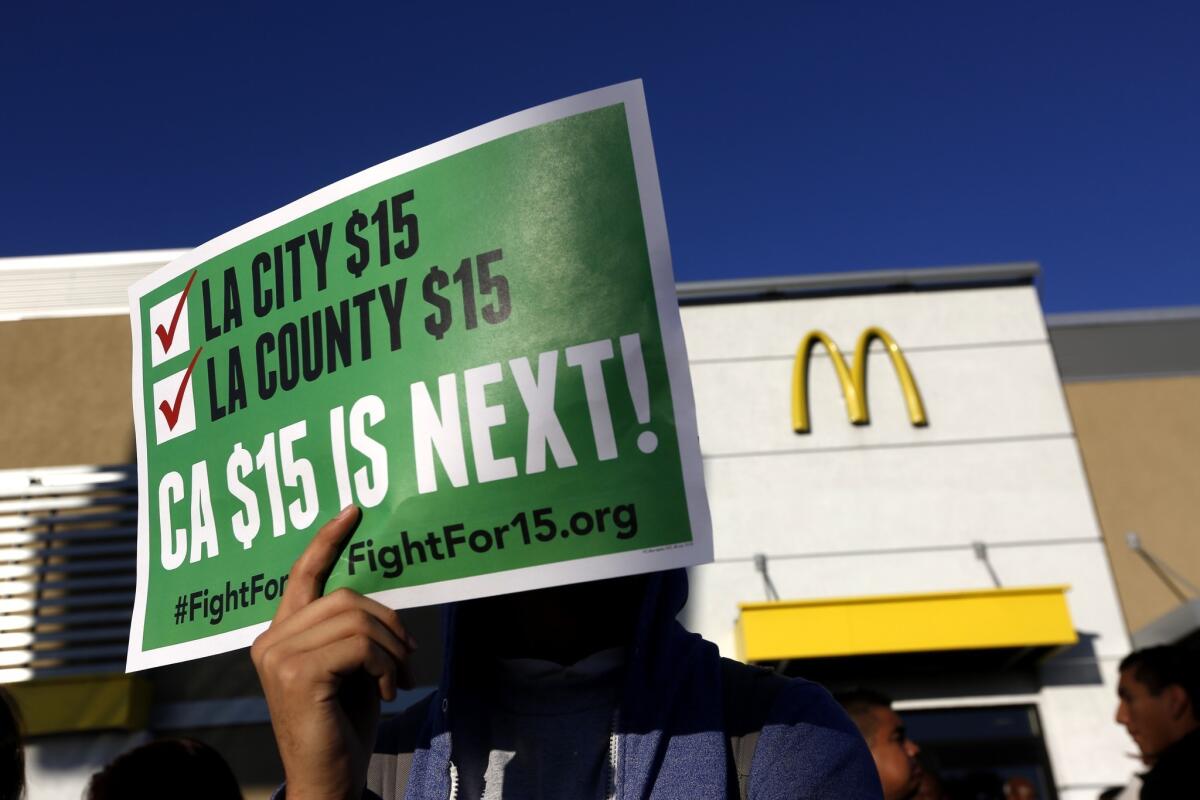 Workers rally for a statewide $15 minimum wage in Sacramento in 2016.