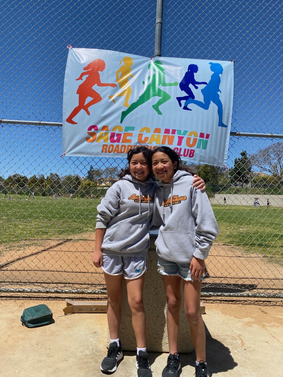 Student Roadrunners Club volunteers Lila Hsing and Juliet Hsing.