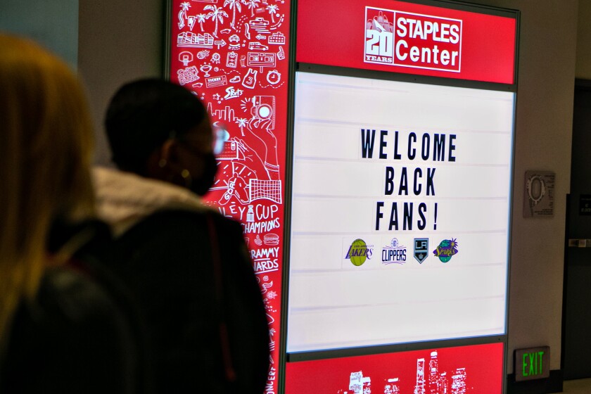 A sign at Staples Center reads "Welcome back fans!"