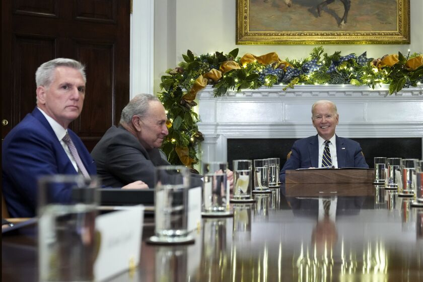 FILE - President Joe Biden, right, at the top of a meeting with congressional leaders to discuss legislative priorities for the rest of the year, Nov. 29, 2022, in the Roosevelt Room of the White House in Washington. From left are House Minority Leader Kevin McCarthy of Calif., Senate Majority Leader Chuck Schumer, of N.Y., and Biden. The president and the House speaker are preparing for their first official visit at the White House on Wednesday, ahead of a looming debt crisis. (AP Photo/Andrew Harnik, File)