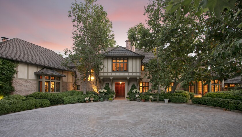 The exterior of an English Tudor-style Beverly Hills home listed at $59.5 million.