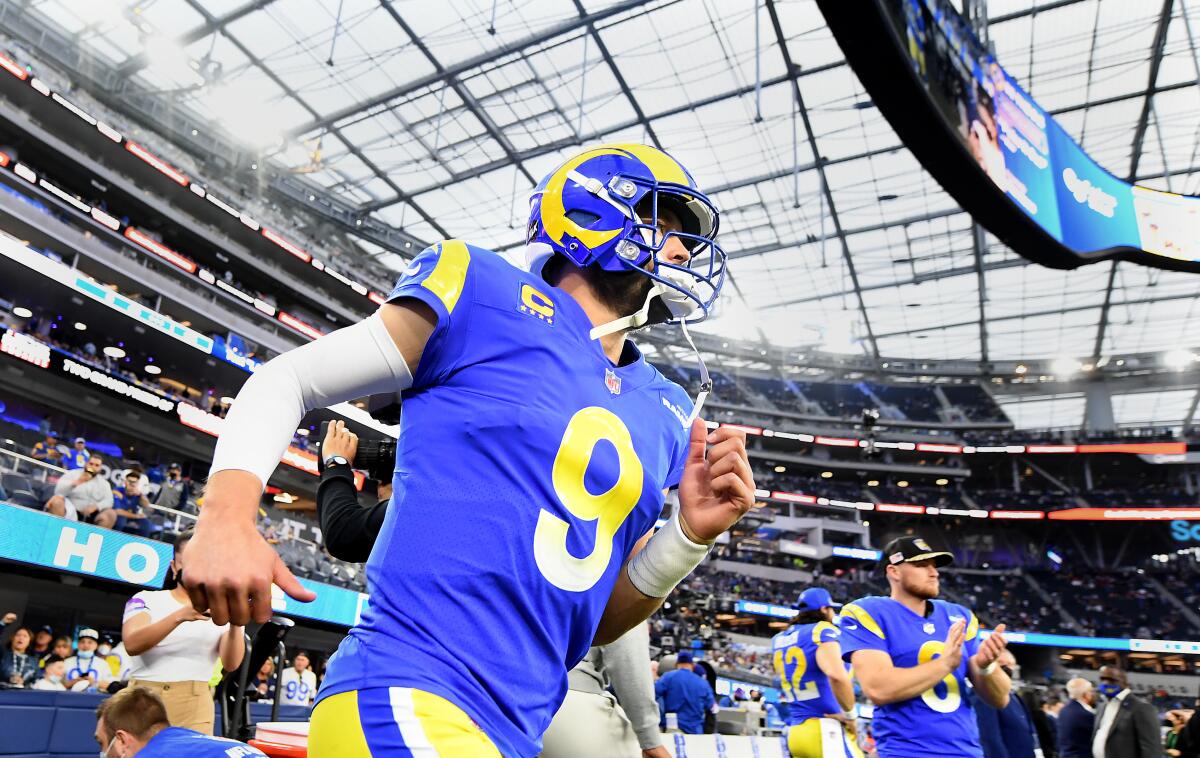Rams quarterback Matthew Stafford takes the field before an NFC wild-card game against the Cardinals.