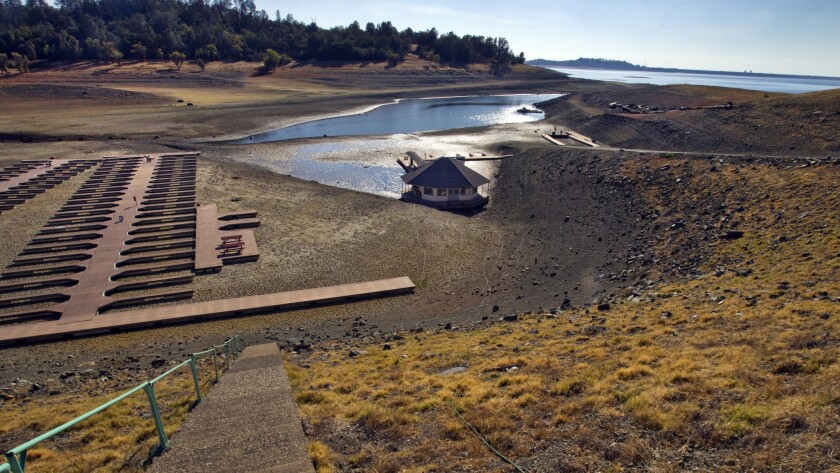 Docks sit empty on the cracked soil at Folsom Lake Marina, one of the state's largest inland marinas. A new study finds drought bands such as those covering the U.S. Southwest are driven by changes in a crucial atmospheric cycle near the equator.