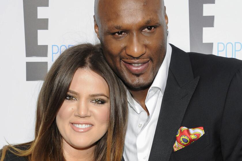 Lamar Odom, shown in 2012 with Khloe Kardashian, has reportedly taken his first steps without assistance since his October overdose.