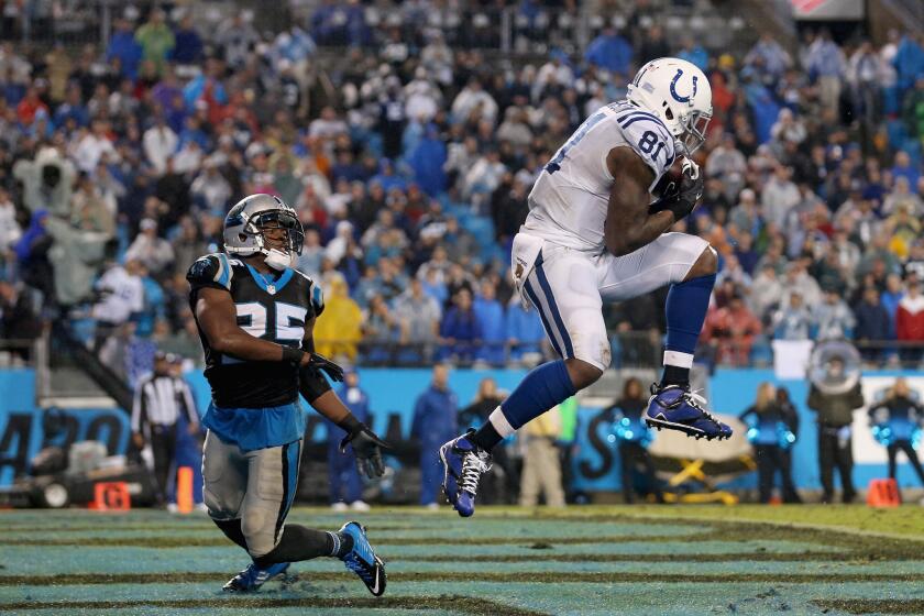 Indianapolis' Andre Johnson catches a touchdown pass against Carolina's Bene' Benwikere on Nov. 2.