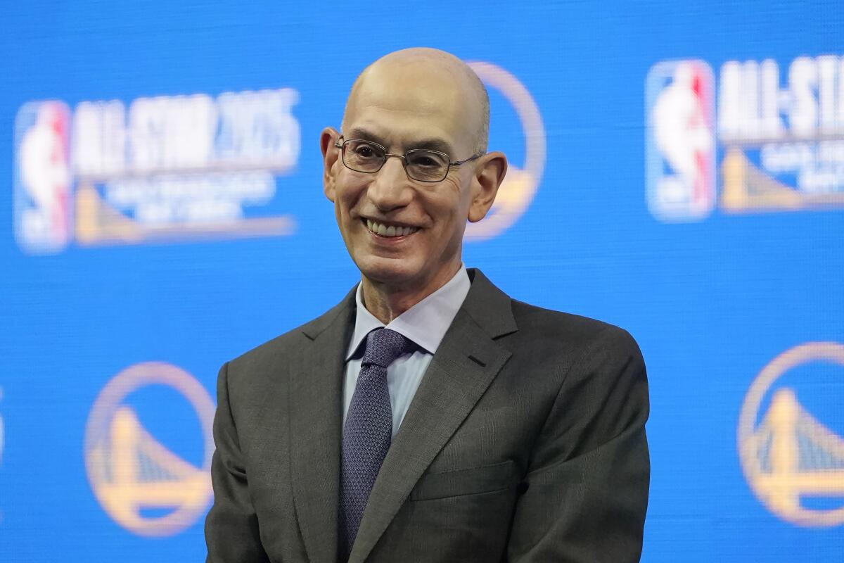 NBA commissioner Adam Silver smiles during a news conference.