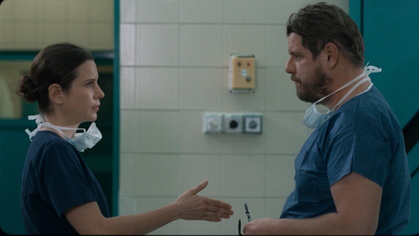 Two doctors, played by Natasa Stork and Viktor Bodó, in "Preparations to Be Together for an Unknown Period of Time."