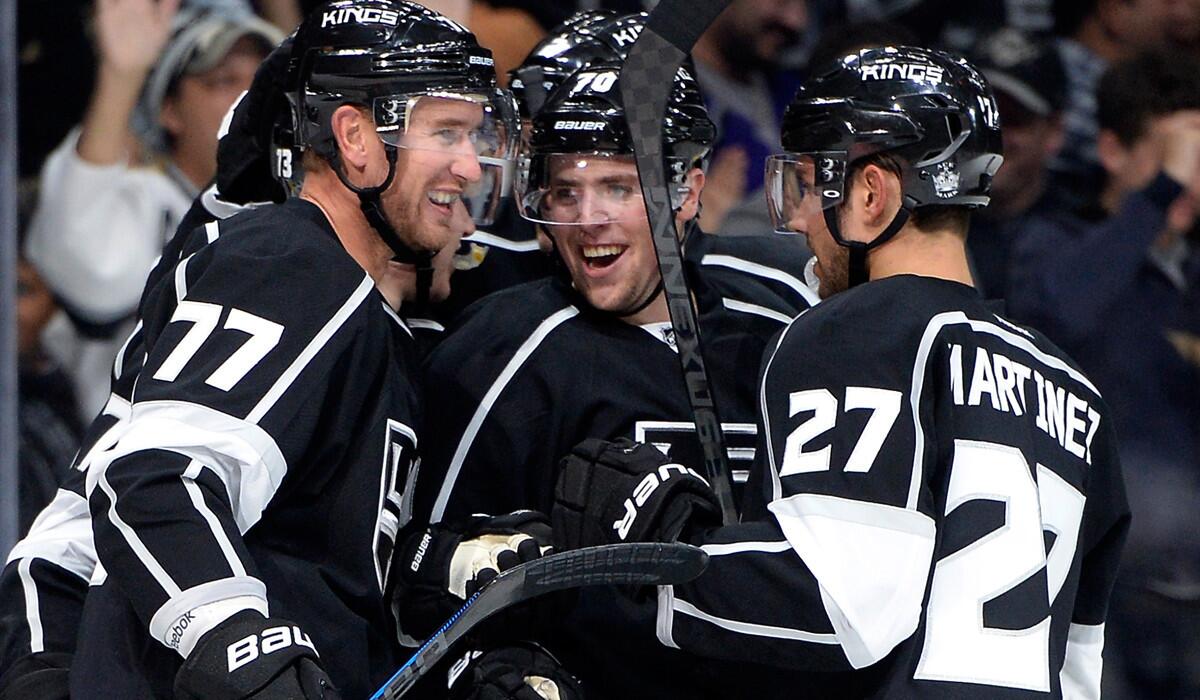 Kings forwards Jeff Carter (77) and Tanner Pearson (center) as well as defenseman Alec Martinez, celebrating a goal against Winnipeg last week, will get an early call to the ice on Sunday against St. Louis.