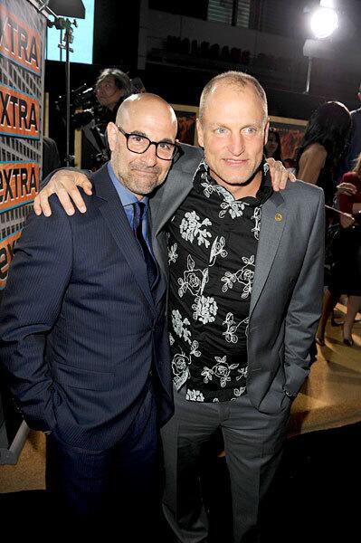 Actors Stanley Tucci (L) and Woody Harrelson play Caesar Flickerman and Haymitch Abernathy, respectively.