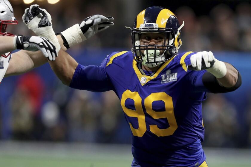 Los Angeles Rams Aaron Donald #99 rushes against the New England Patriots during NFL Super Bowl 53, Sunday, February 3, 2019 in Atlanta. (AP Photo/Gregory Payan)