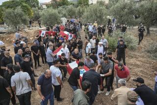 TRIPOLI, LEBANON - OCTOBER 16: Relatives mourn during a funeral of 23 people, including 4 infants, women, and elderly, who lost their lives in an Israeli airstrike on the town of Aytu in northern Lebanon's Tripoli region on October 16, 2024.The victims were members of a migrant family from southern Lebanon's Aytaroun in the Bint Jbeil area, who had relocated three times before the attack reached them at their fourth refuge. (Photo by Murat Sengul/Anadolu via Getty Images)