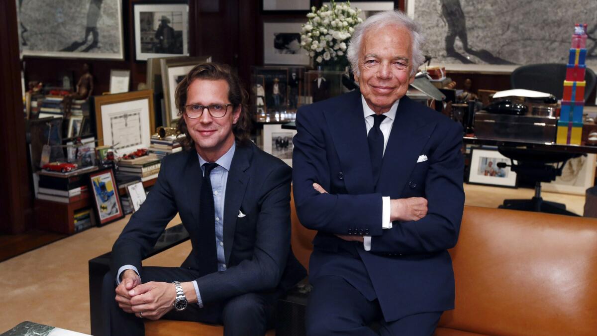 Designer Ralph Lauren, right, poses in his office with his successor as CEO, Stefan Larsson.