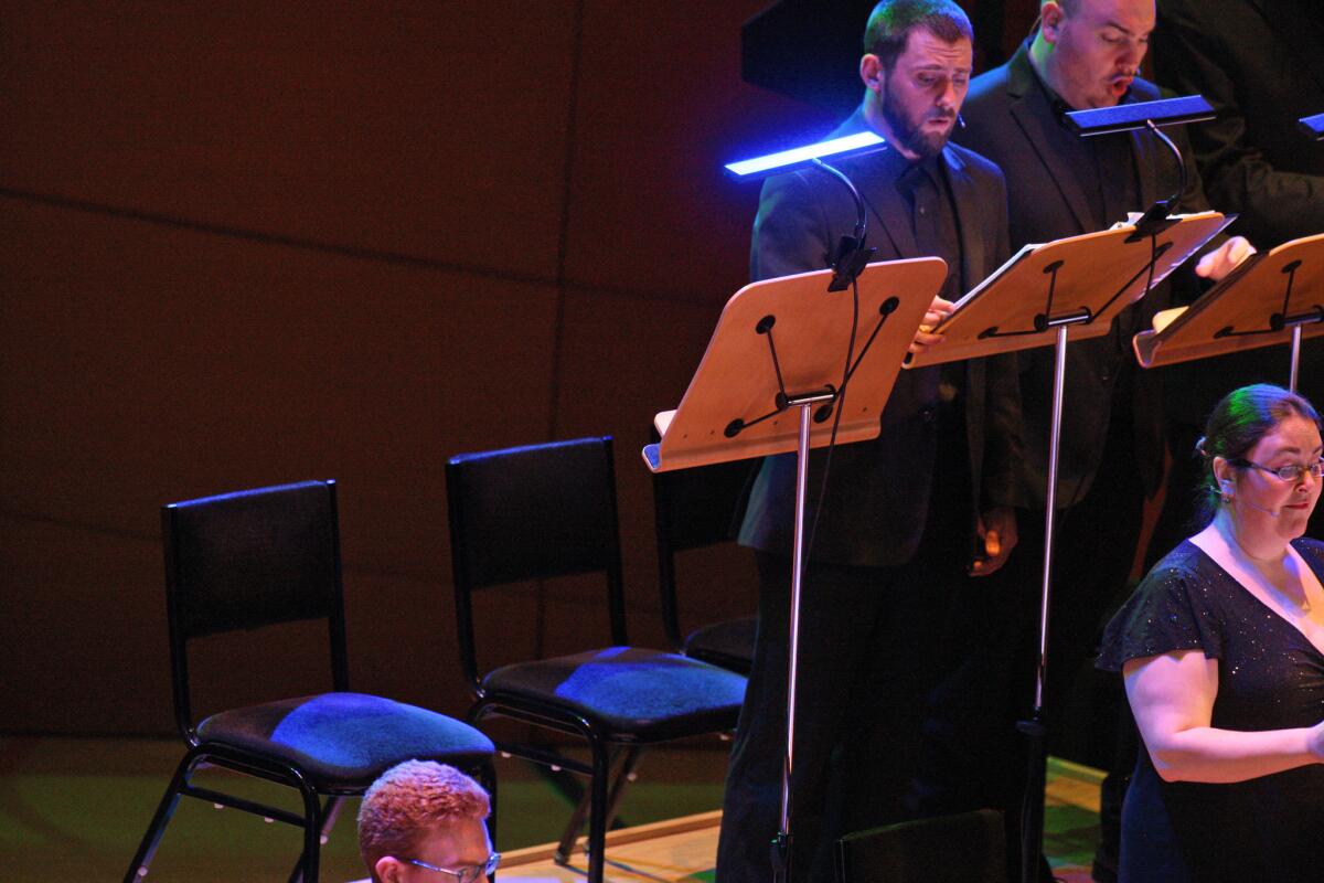 An empty chair (far left) for Jeffrey Dinsmore as the Crossing performs during the Los Angeles Philharmonic Minimalist Jukebox concert of "De Materie" on April 18 at Walt Disney Concert Hall in Los Angeles. Dinsmore, one of the founding members of the Crossing, died last week. The concert was dedicated to his memory.