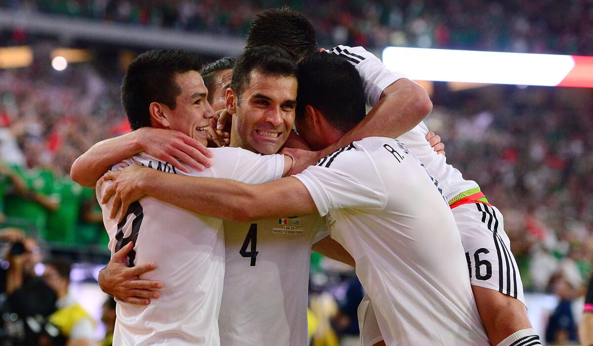 Rafael Marquez (4) celebrates with teammates after scoring a goal in Mexico's Copa America Centenario match against Uruguay at University of Phoenix Stadium on Sunday.