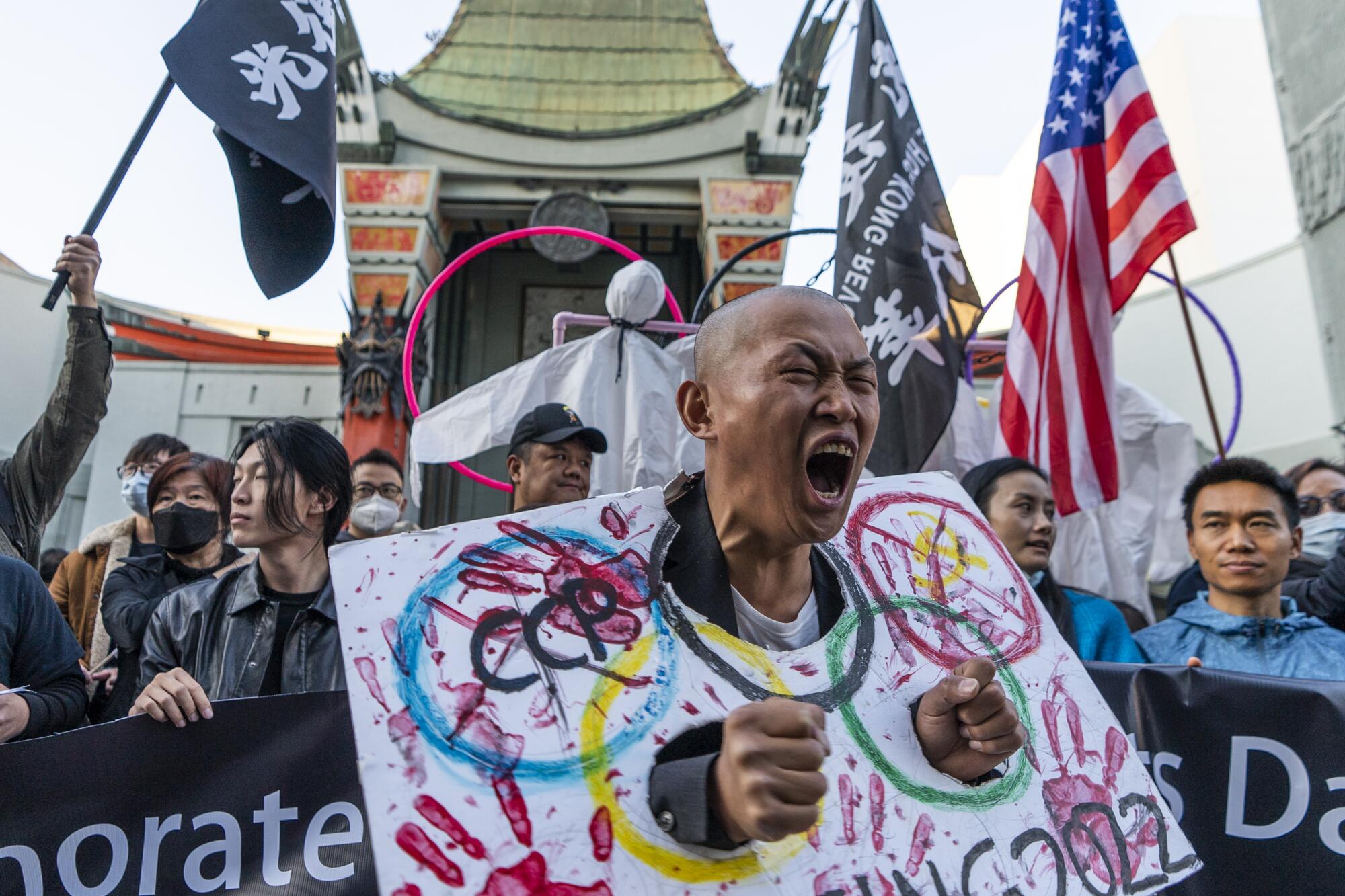 Protester Lijian Jie screams as he joins demonstrators at a rally to protest the Beijing 2022 Winter Olympic Games.