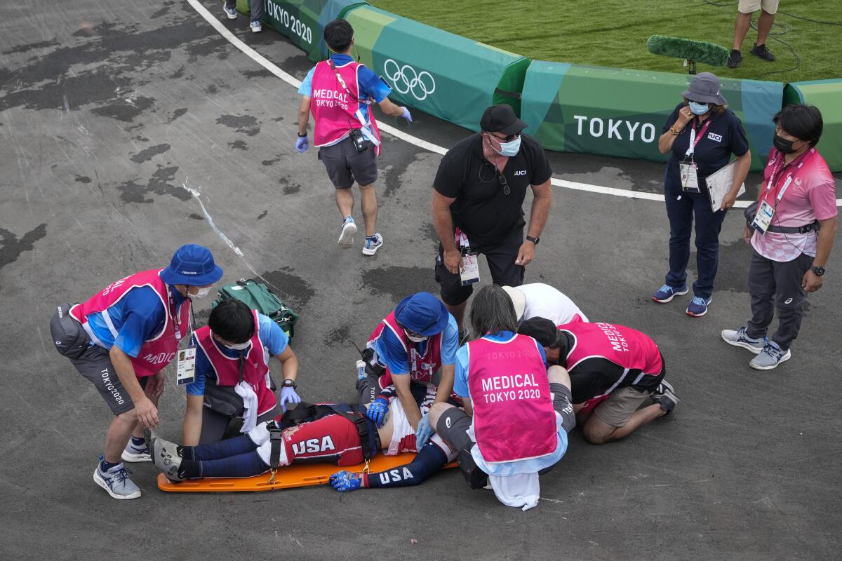 Medics prepare to carry away U.S. BMX rider Connor Fields on a stretcher after he crashed.