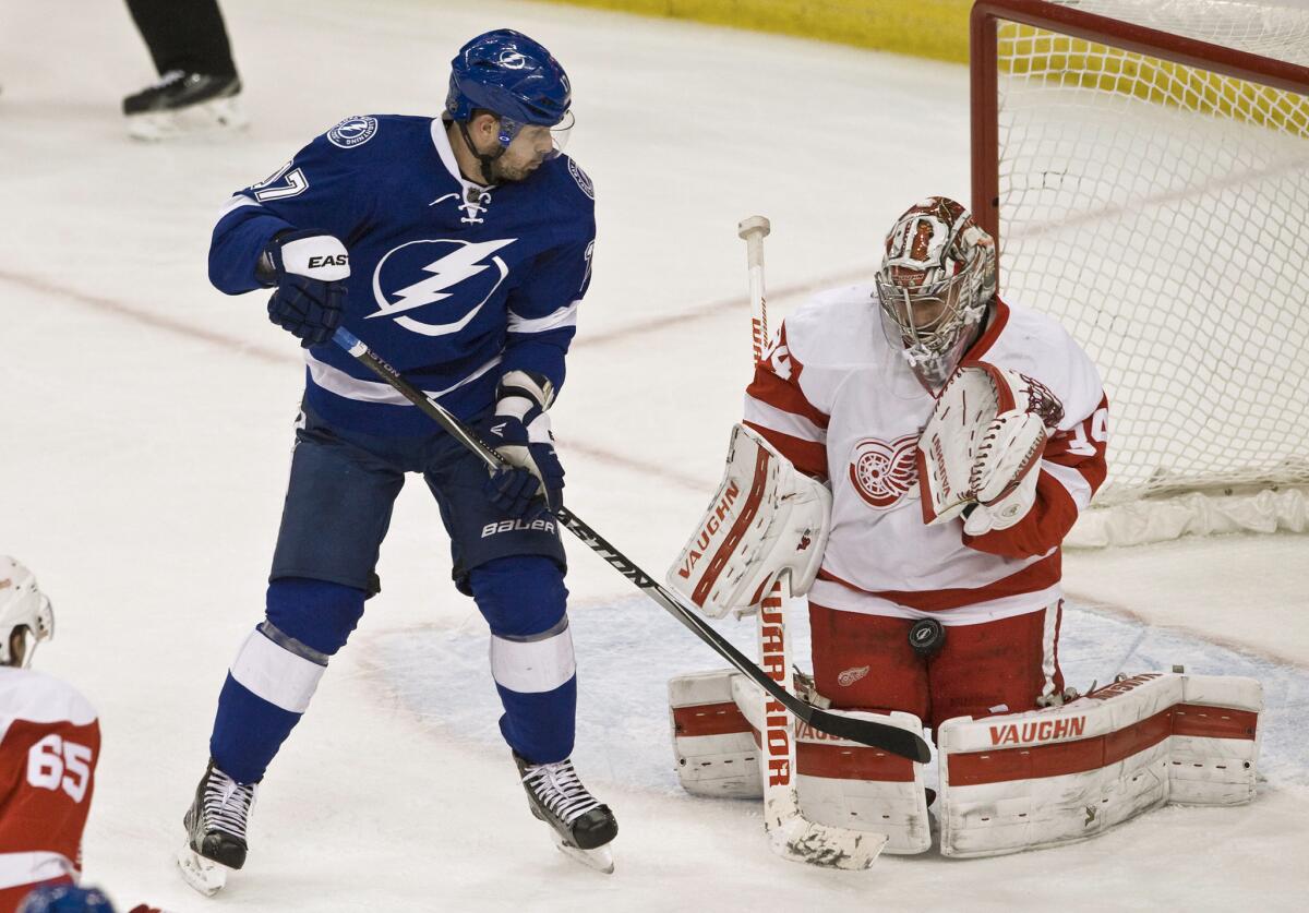 Red Wings goalie Petr Mrazek (34) stops a shot from Tampa Bay Lightning's Alex Killorn, left, during the second period on Mar. 22.