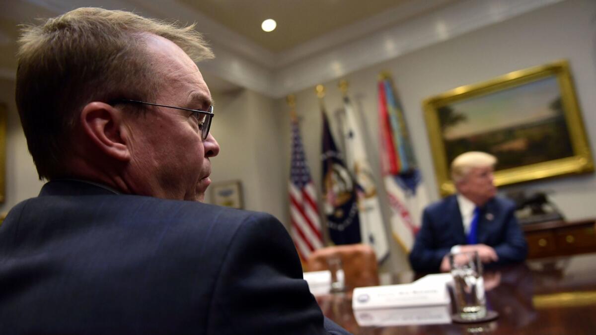 White House budget director Mick Mulvaney attends a meeting with President Trump in Washington on Nov. 28.