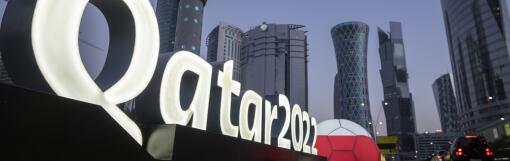 FILE - Branding is displayed near the Doha Exhibition and Convention Center, in Doha, Qatar, March 31, 2022