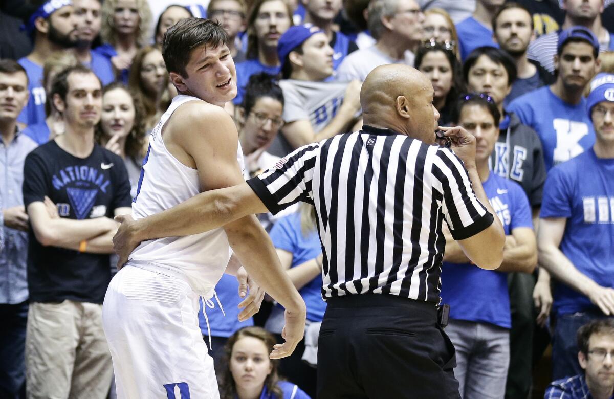 An official assists Duke guard Grayson Allen following an injury during the second half of a game against Appalachian State on Nov. 26.