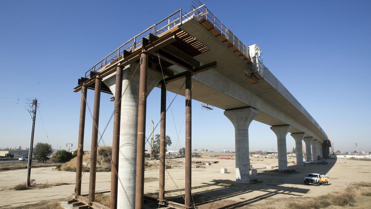 Crews work in December 2017 on an elevated section of the high-speed rail project in Fresno.