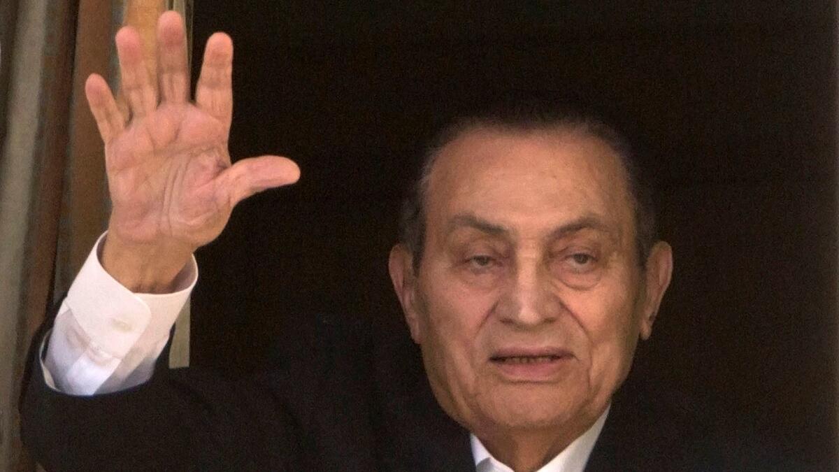 Ousted Egyptian President Hosni Mubarak waves to supporters from Maadi Military Hospital in Cairo in April 2016.